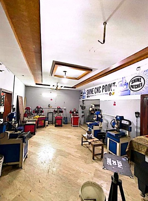CNC machine hall with tripod lighting